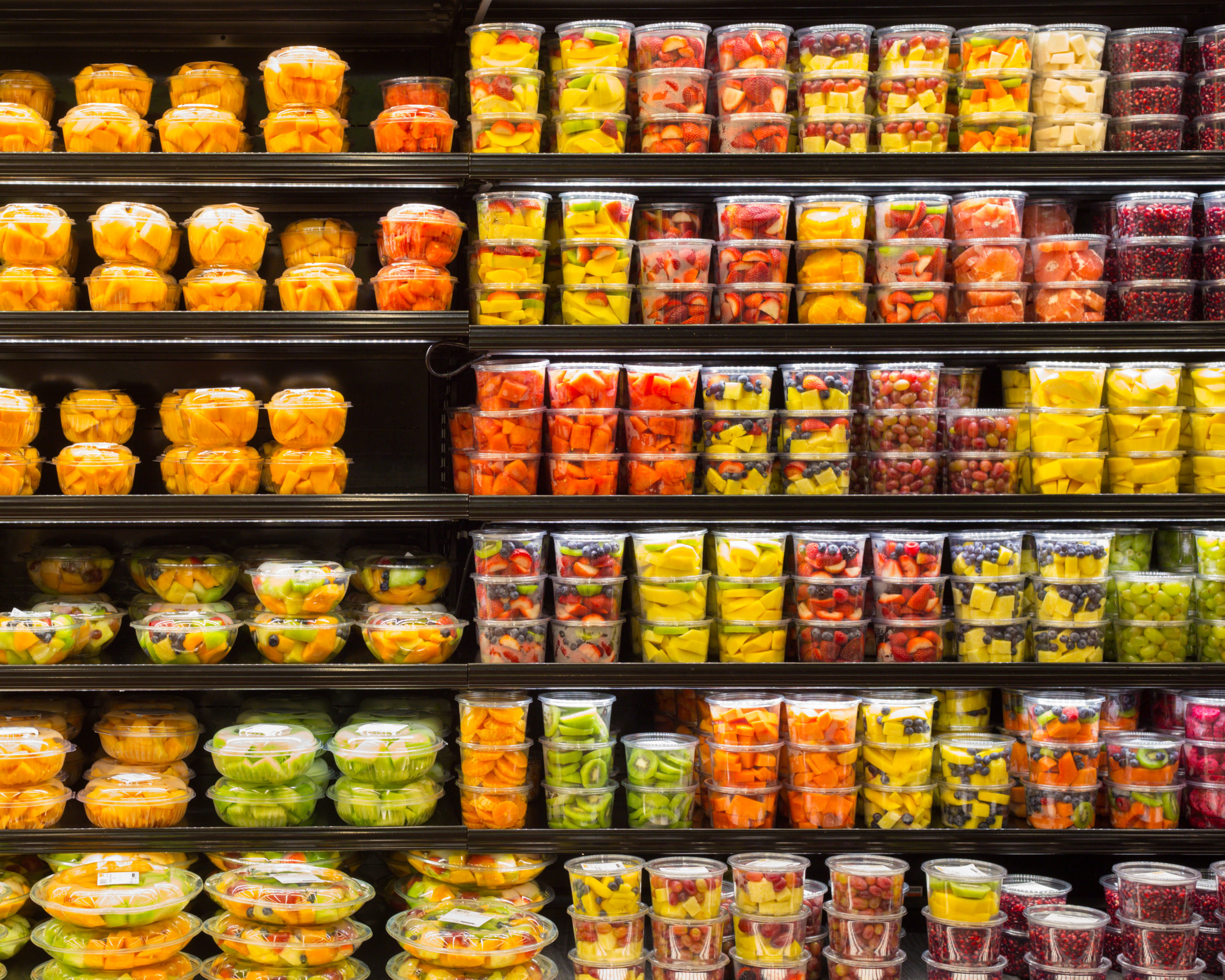 Assortment of cut fruit in containers on display for sale at FNGs remain popular Grab N' Go items at all stores.